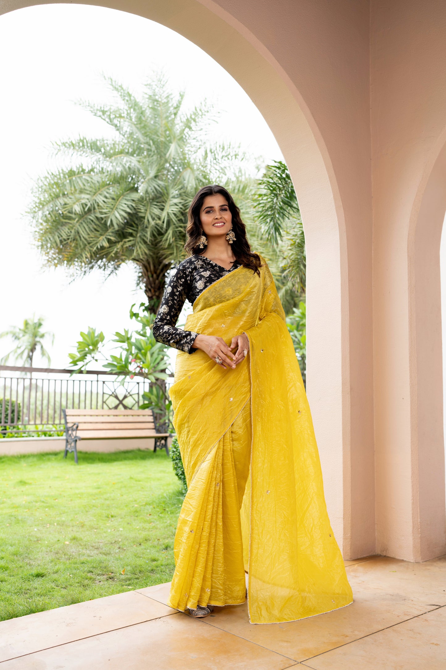 Elegant Soft Organza Saree in a beautiful yellow color, paired with a luxurious Banarasi blouse